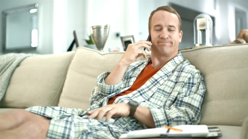 Peyton Manning grimaces at his pencil-and-paper day planner. (Screenshot: DirecTV)
